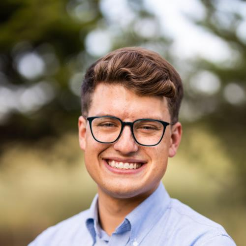 Garett Butler smiling outdoors